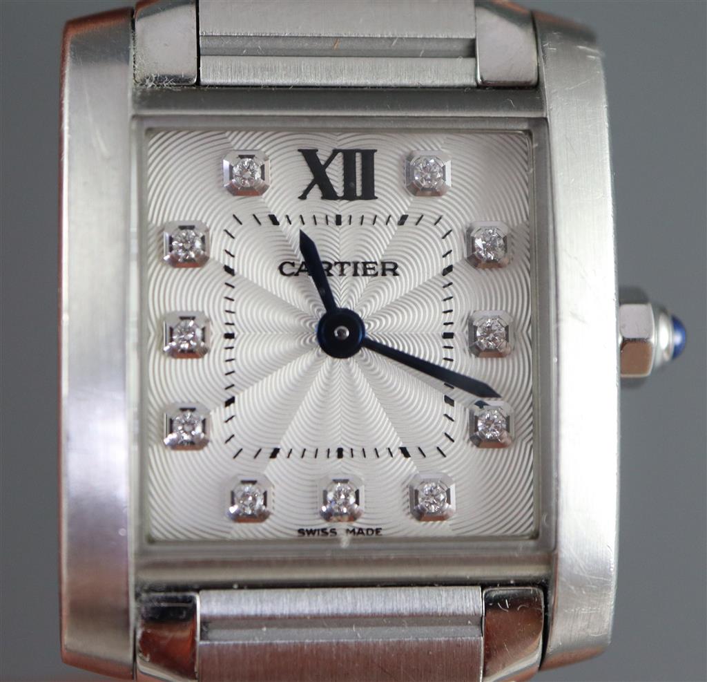 A ladys modern stainless steel Cartier Tank quartz wrist watch with diamond set numerals,